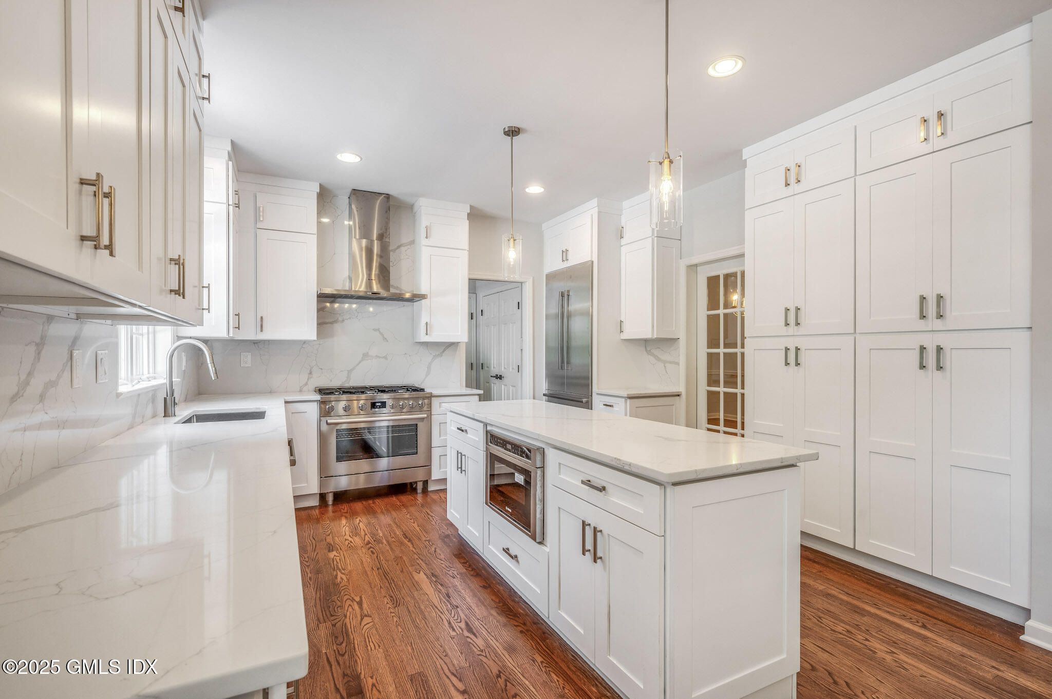 Interior, Kitchen, Marble Walls, Pendant Lights, Recessed Lighting, Stainless Steel Appliances, Wood Texture Flooring