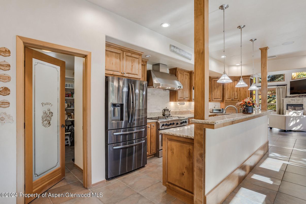 Fireplace, Interior, Kitchen, Pendant Lights, Recessed Lighting, Stainless Steel Appliances