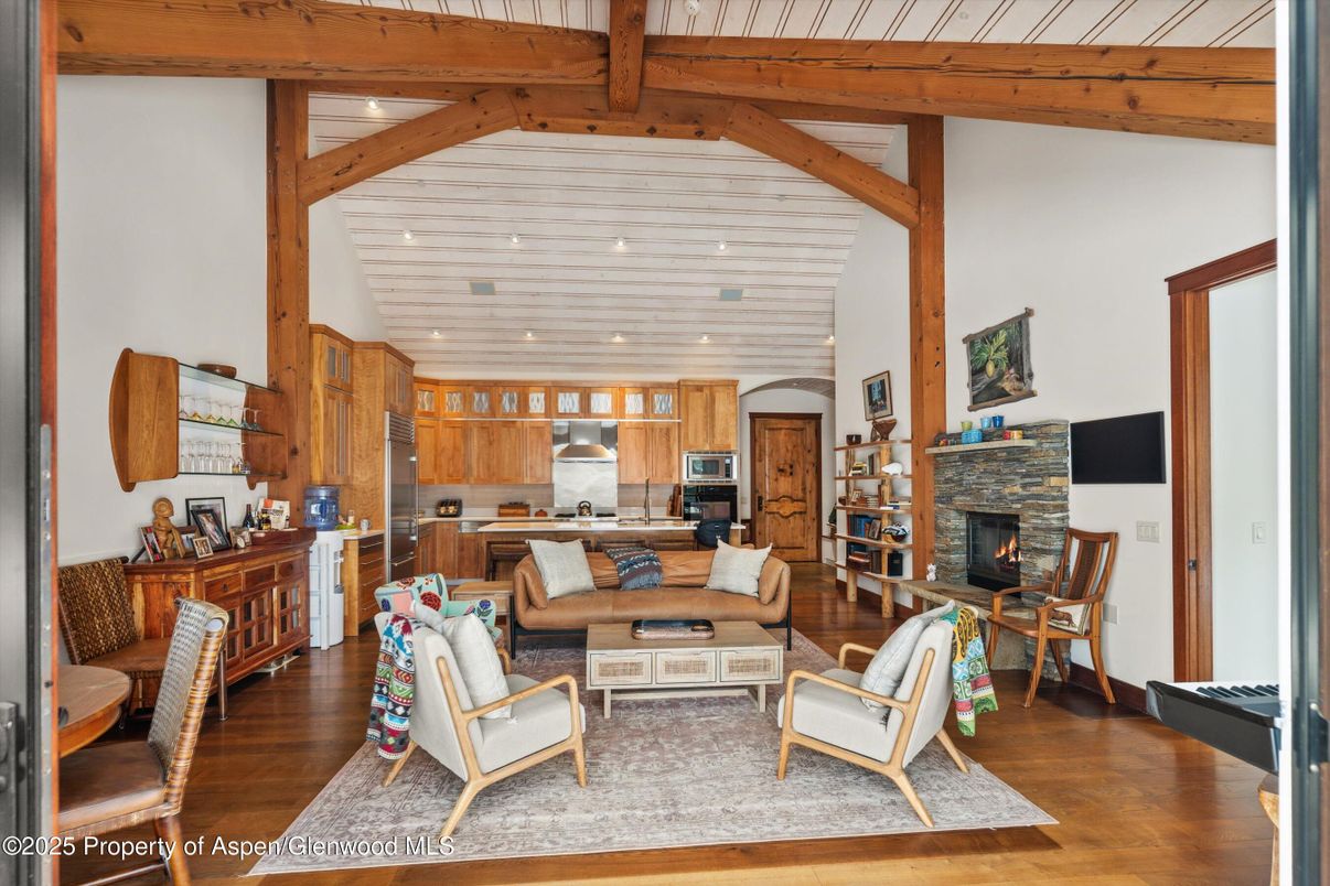 Fireplace, Interior, Kitchen, Living room, Recessed Lighting, Stainless Steel Appliances, Wooden Beams, Wood Texture Flooring