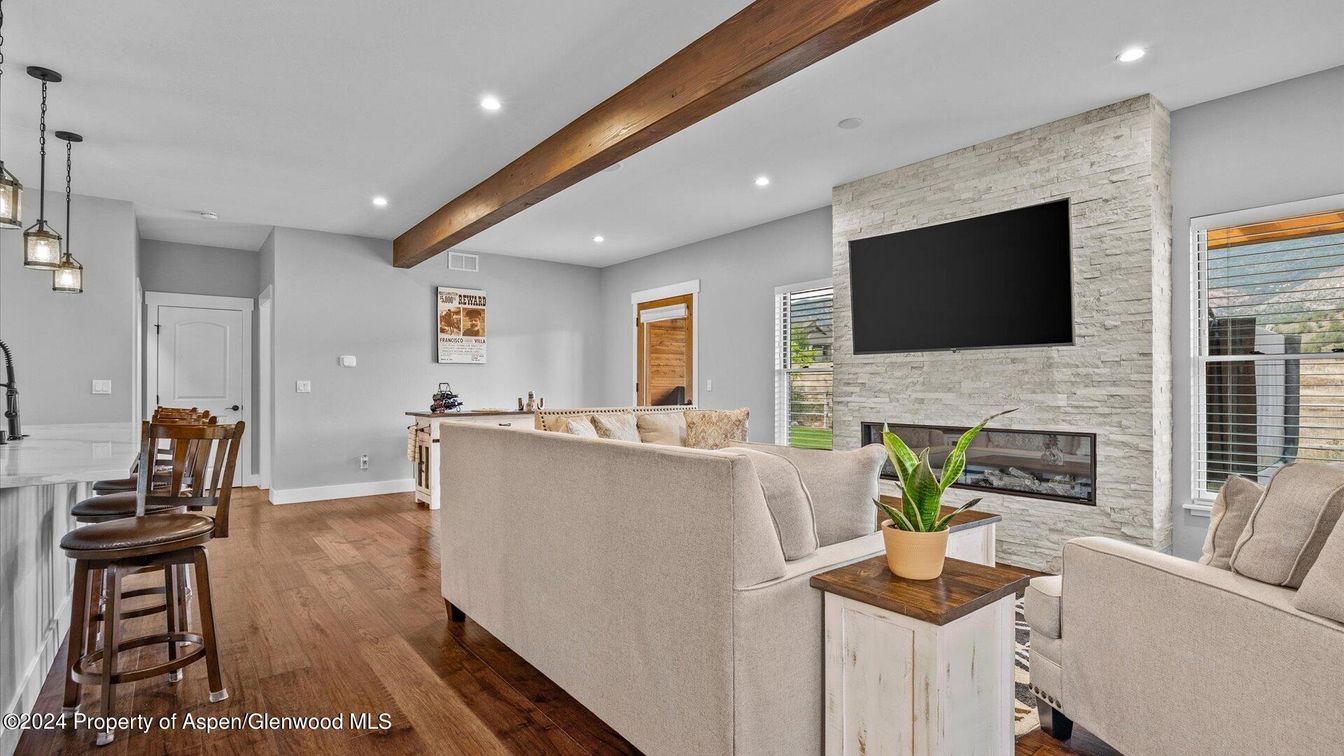 Fireplace, Interior, Living room, Pendant Lights, Recessed Lighting, Stone Walls, Wooden Beams, Wood Texture Flooring