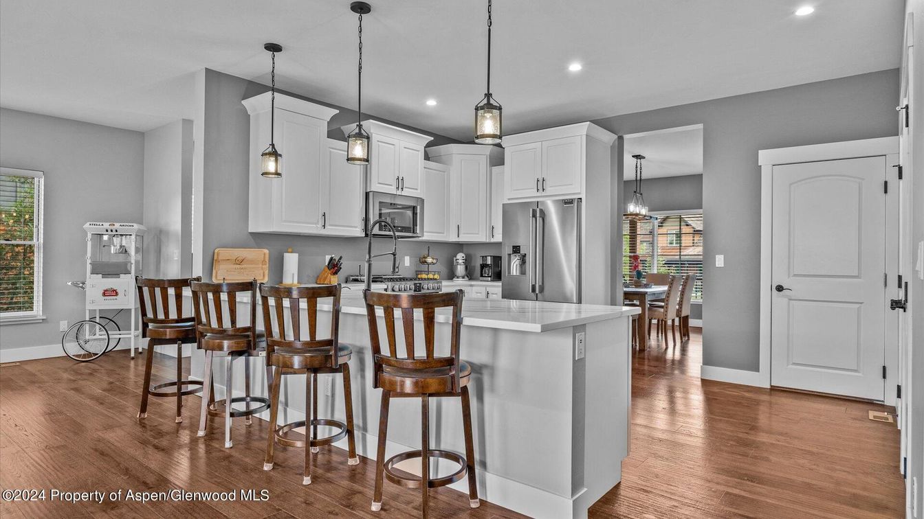 Dining room, Interior, Kitchen, Pendant Lights, Recessed Lighting, Stainless Steel Appliances, Wood Texture Flooring