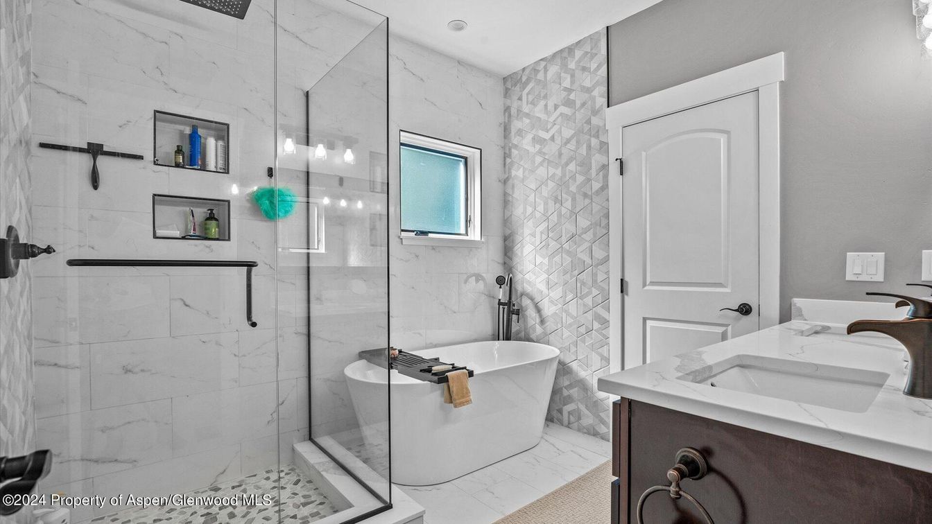 Bathroom, Dual Sink Vanities, Free Standing Baths, Glass Shower, Interior, Marble Walls, Recessed Lighting