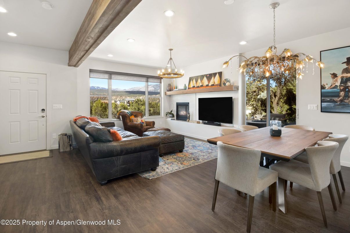 Chandelier, Dining room, Fireplace, Interior, Living room, Pendant Lights, Recessed Lighting, Wooden Beams, Wood Texture Flooring