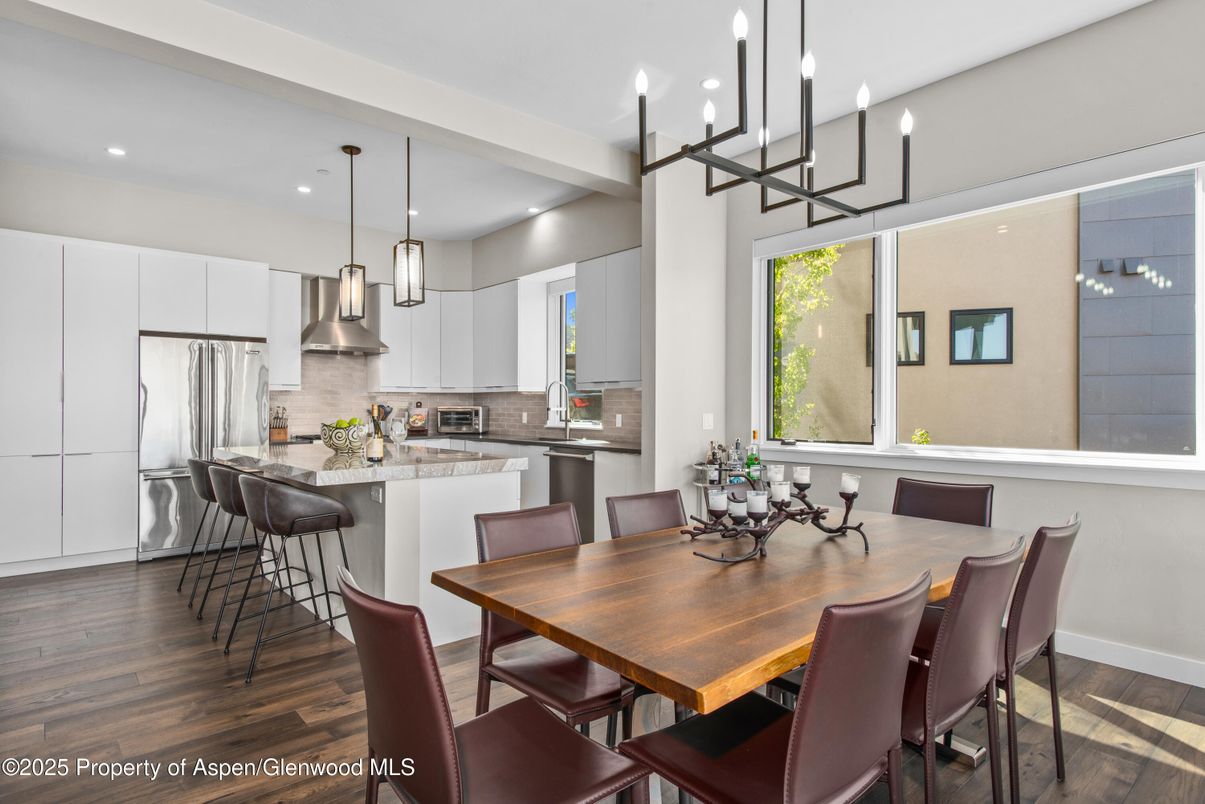 Dining room, Interior, Kitchen, Pendant Lights, Recessed Lighting, Stainless Steel Appliances, Wood Texture Flooring