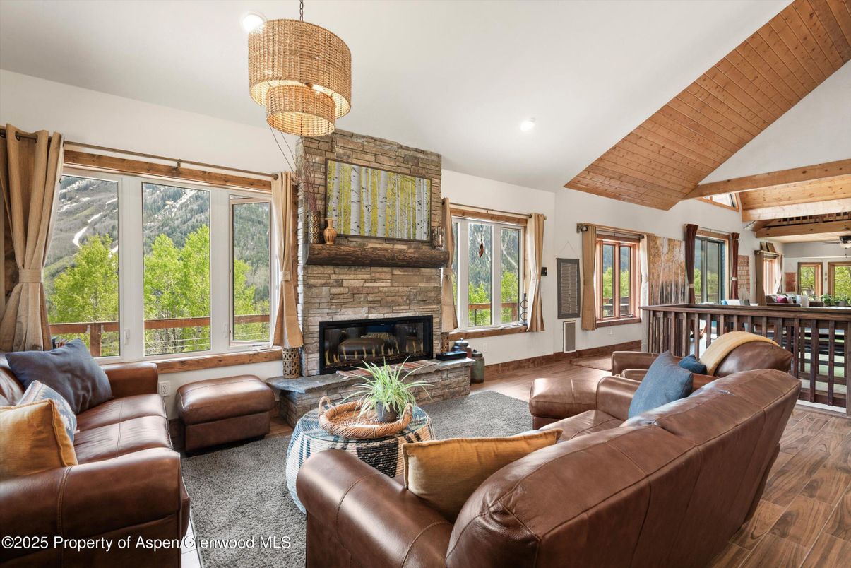 Chandelier, Fireplace, Interior, Living room, Recessed Lighting, Wooden Beams, Wooden Ceilings, Wood Texture Flooring
