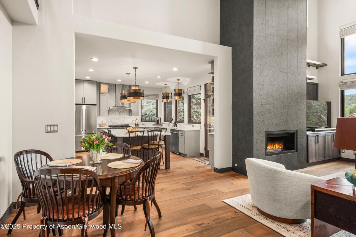 Dining room, Fireplace, Interior, Kitchen, Living room, Pendant Lights, Recessed Lighting, Stainless Steel Appliances, Wood Texture Flooring