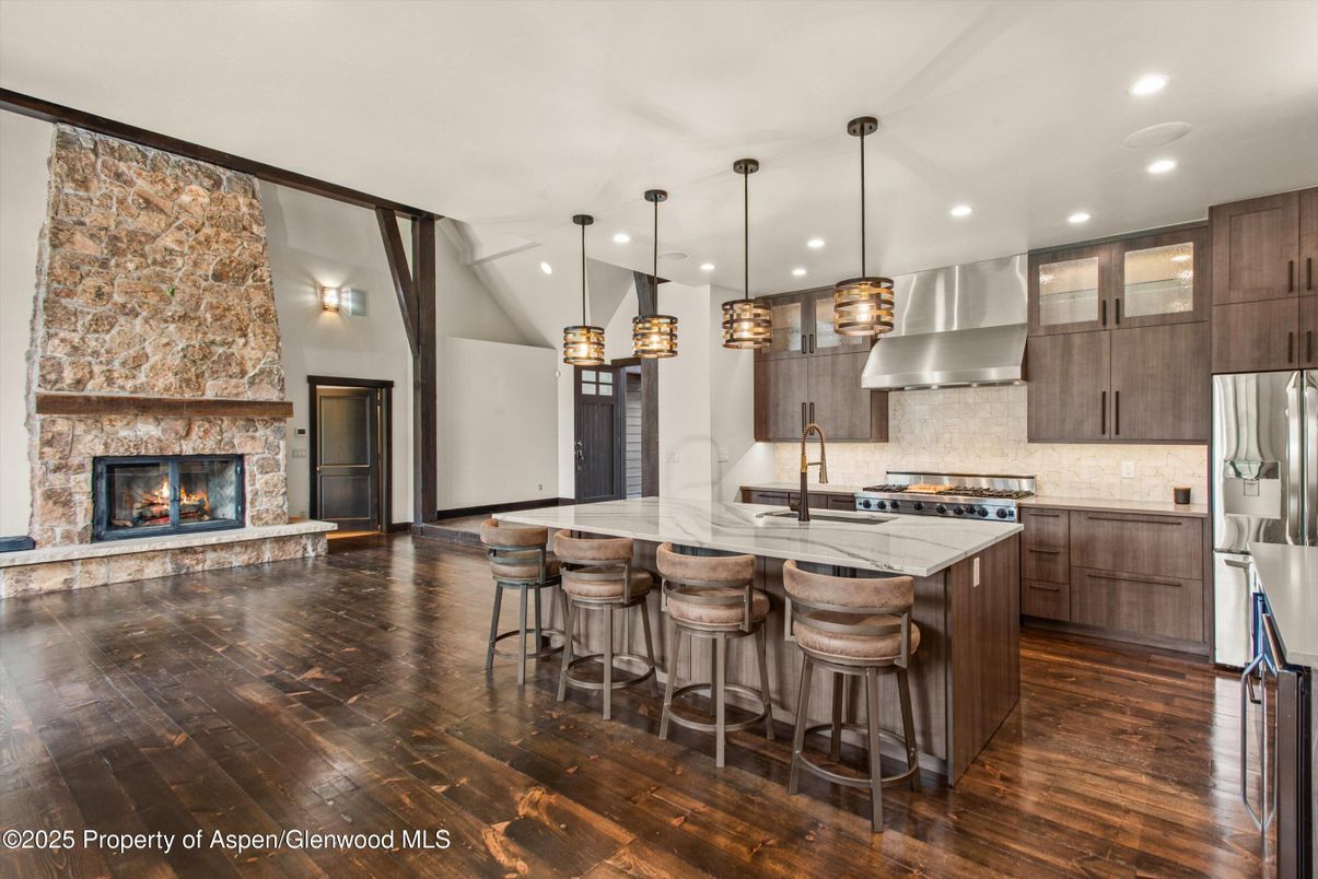 Fireplace, Interior, Kitchen, Pendant Lights, Recessed Lighting, Stainless Steel Appliances, Wood Texture Flooring