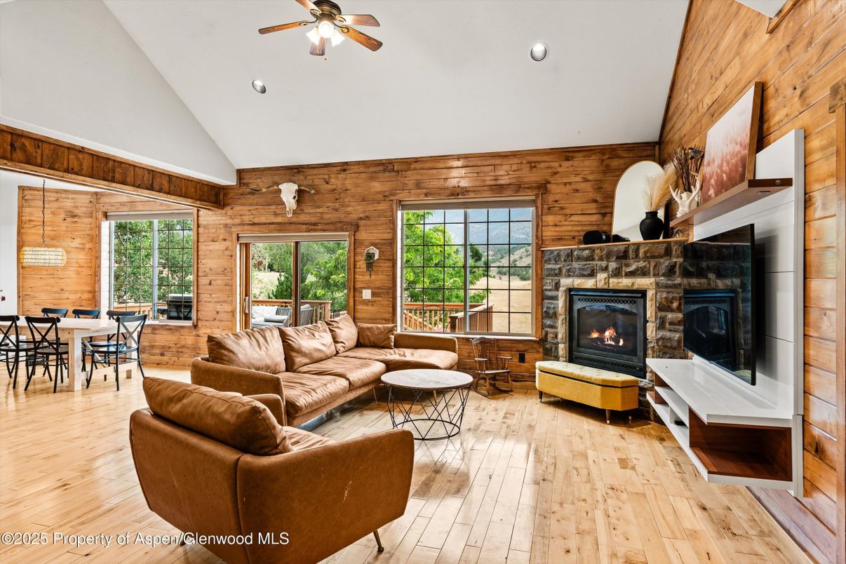 Dining room, Fireplace, Interior, Living room, Pendant Lights, Recessed Lighting, Wood Texture Flooring, Wooden Walls