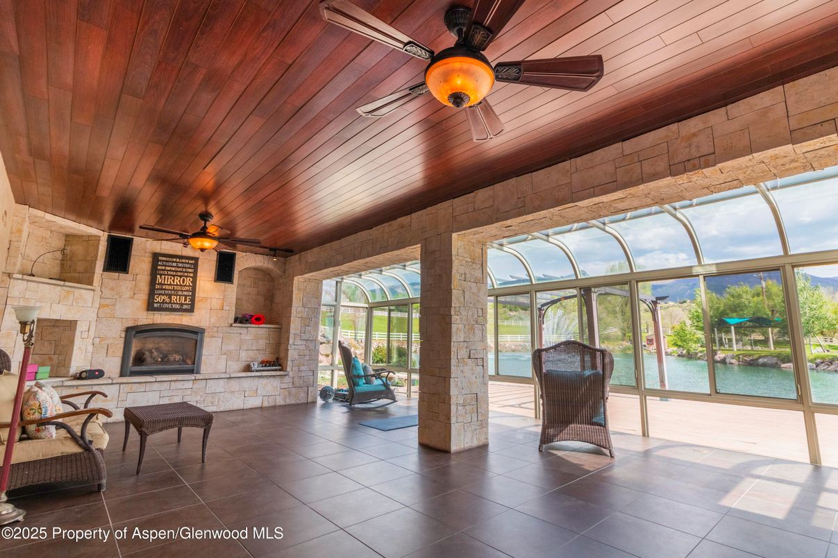 Fireplace, Interior, Stone Walls, Sun Room, Water, Wooden Ceilings