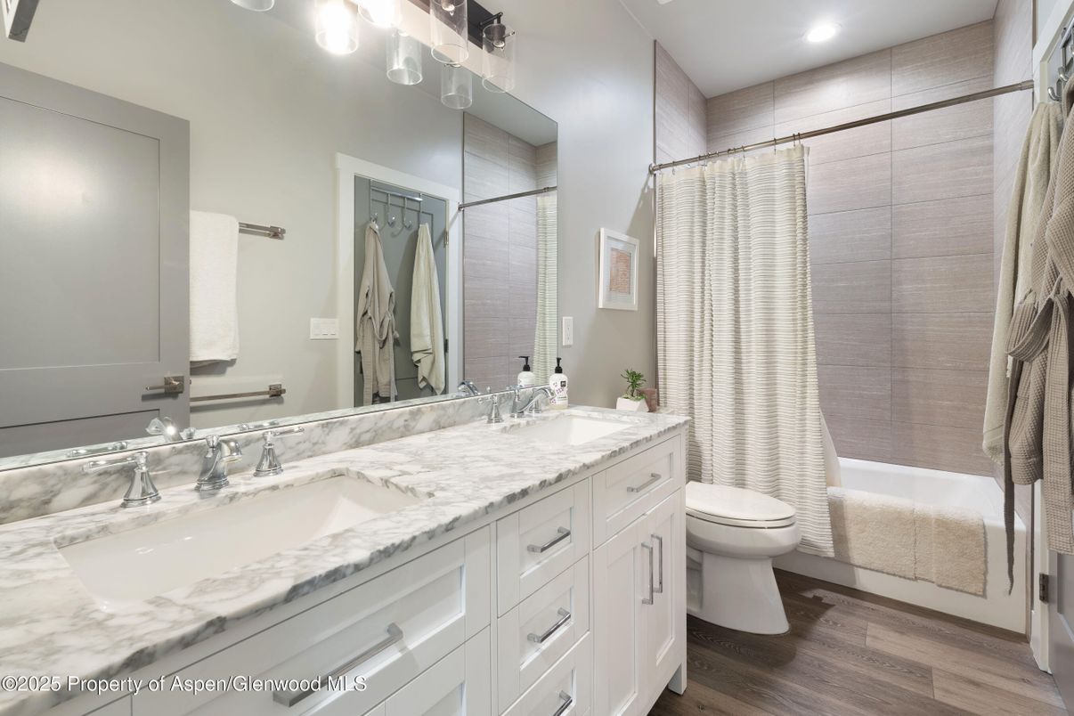 Bathroom, Dual Sink Vanities, Interior, Recessed Lighting, Wood Texture Flooring