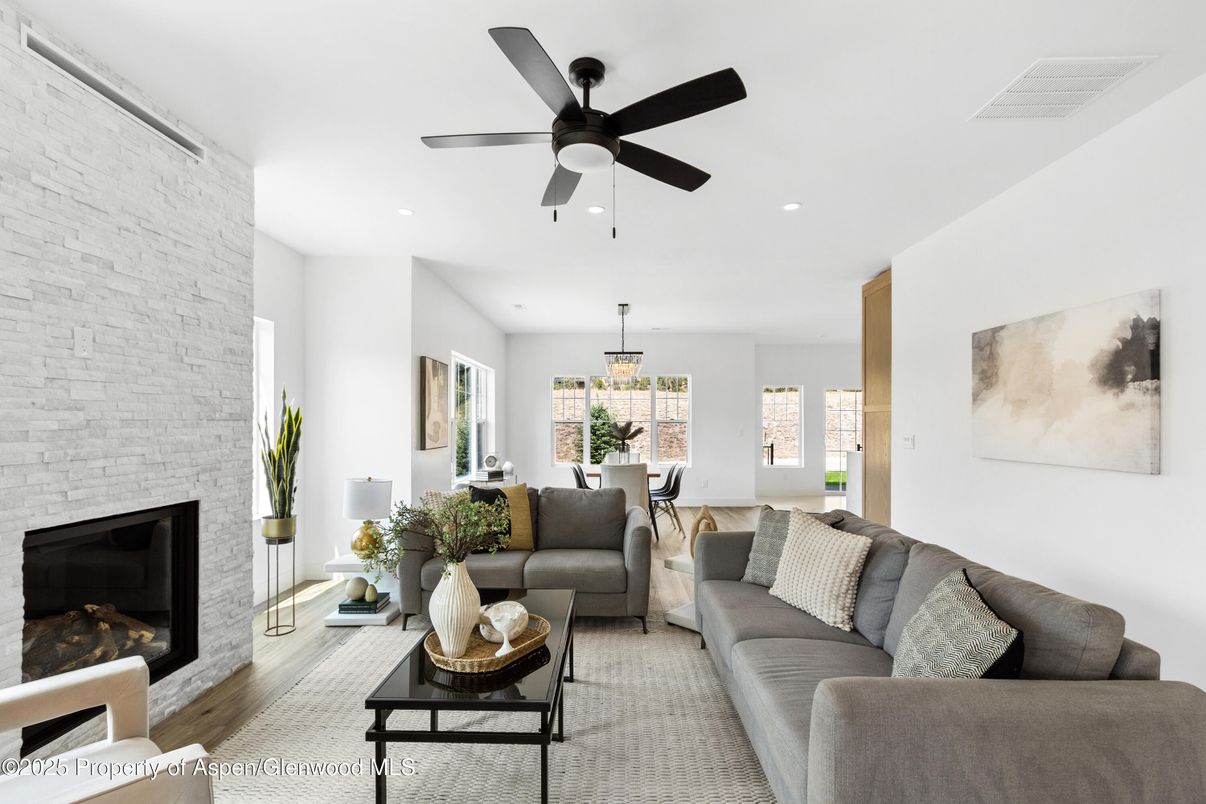 Chandelier, Dining room, Fireplace, Interior, Living room, Recessed Lighting, Stone Walls, Wood Texture Flooring