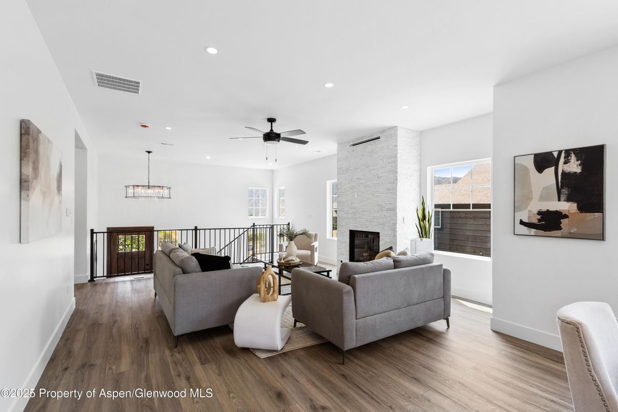 Fireplace, Interior, Living room, Pendant Lights, Recessed Lighting, Stone Walls, Wood Texture Flooring