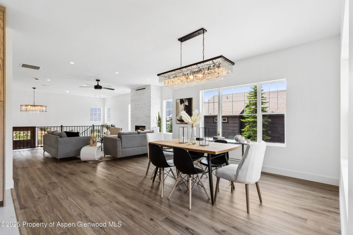 Chandelier, Dining room, Fireplace, Interior, Living room, Pendant Lights, Recessed Lighting, Wood Texture Flooring