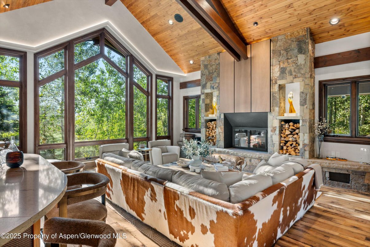 Dining room, Fireplace, Interior, Living room, Recessed Lighting, Stone Walls, Wooden Beams, Wooden Ceilings, Wood Texture Flooring