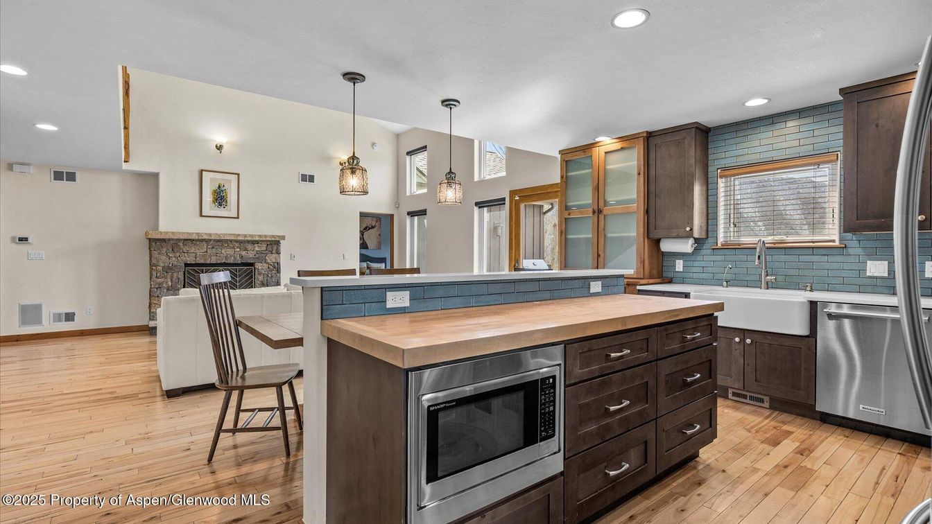 Fireplace, Interior, Kitchen, Pendant Lights, Recessed Lighting, Stainless Steel Appliances, Wood Texture Flooring