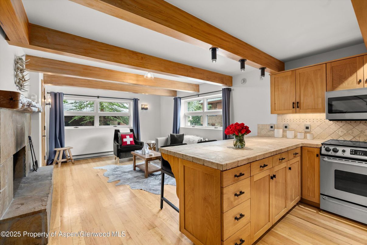 Fireplace, Interior, Kitchen, Living room, Tile Countertops, Wooden Beams, Wood Texture Flooring