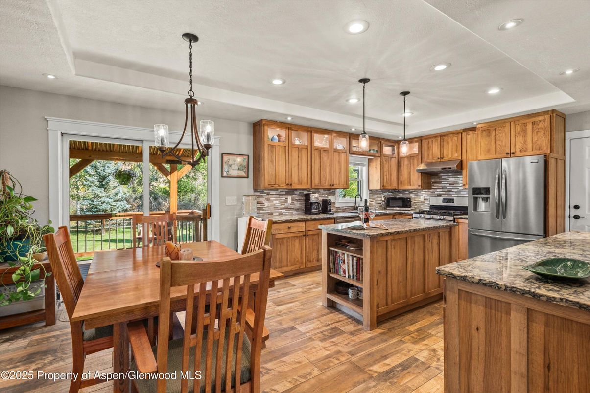 Dining room, Interior, Kitchen, Pendant Lights, Recessed Lighting, Stainless Steel Appliances, Wood Texture Flooring