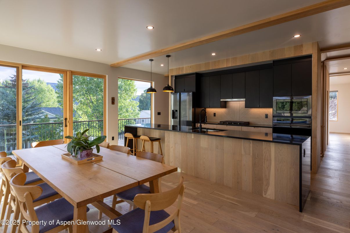Dining room, Interior, Kitchen, Pendant Lights, Recessed Lighting, Stainless Steel Appliances, Wood Texture Flooring
