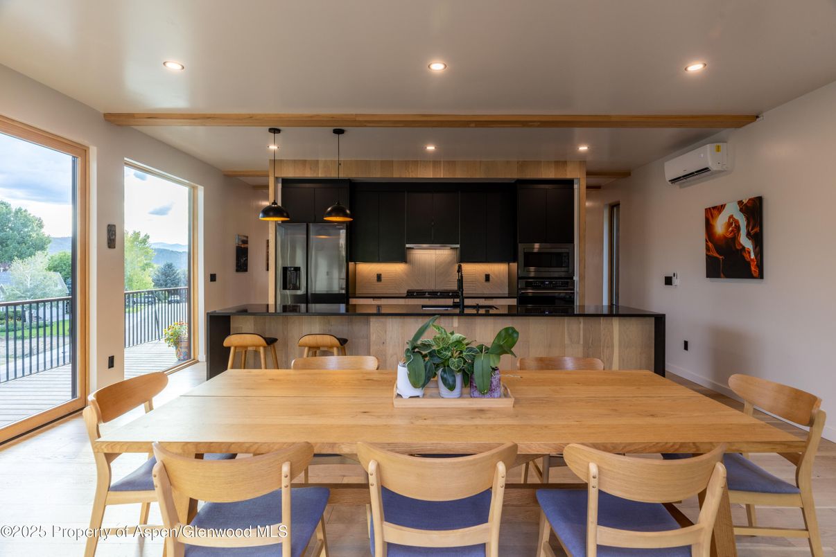 Dining room, Interior, Kitchen, Pendant Lights, Recessed Lighting, Stainless Steel Appliances, Wood Texture Flooring