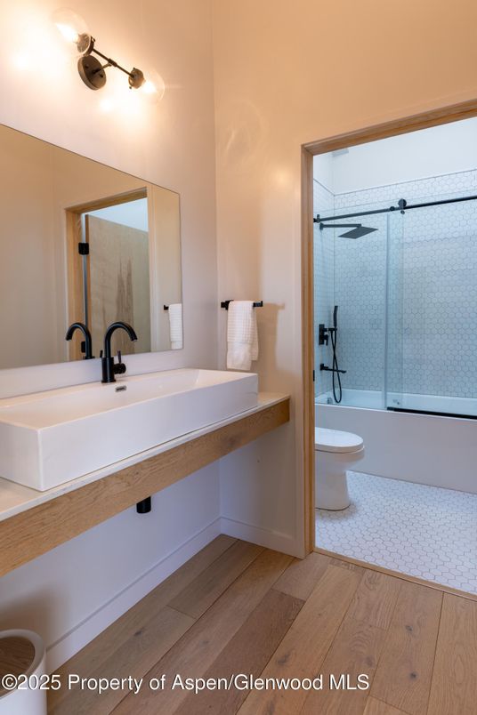 Bathroom, Dual Sink Vanities, Glass Shower, Interior, Wood Texture Flooring