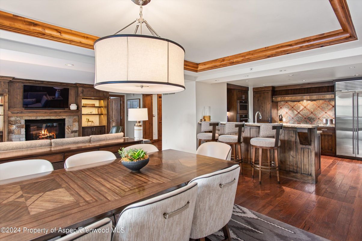 Dining room, Fireplace, Interior, Kitchen, Living room, Pendant Lights, Recessed Lighting, Stainless Steel Appliances, Wood Texture Flooring