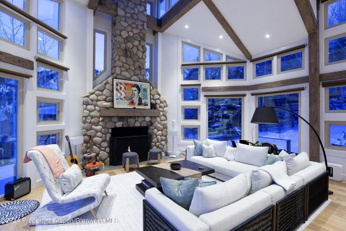 Fireplace, Interior, Living room, Recessed Lighting, Stone Walls, Wood Texture Flooring