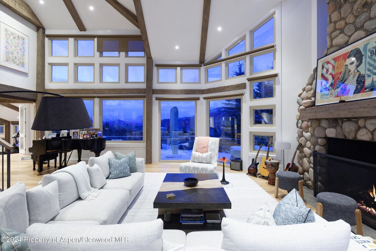 Fireplace, Interior, Living room, Piano, Recessed Lighting, Stone Walls, Wood Texture Flooring
