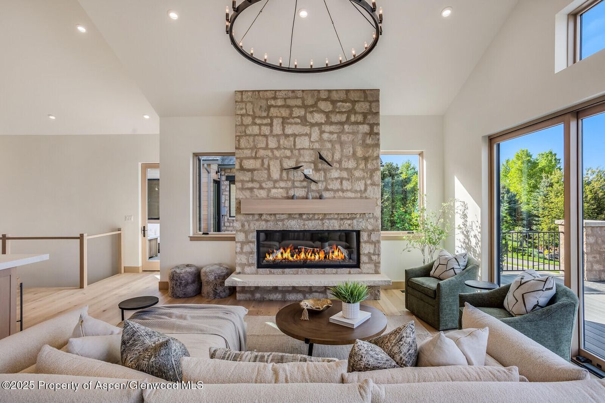 Fireplace, Interior, Living room, Recessed Lighting, Stone Walls, Wood Texture Flooring