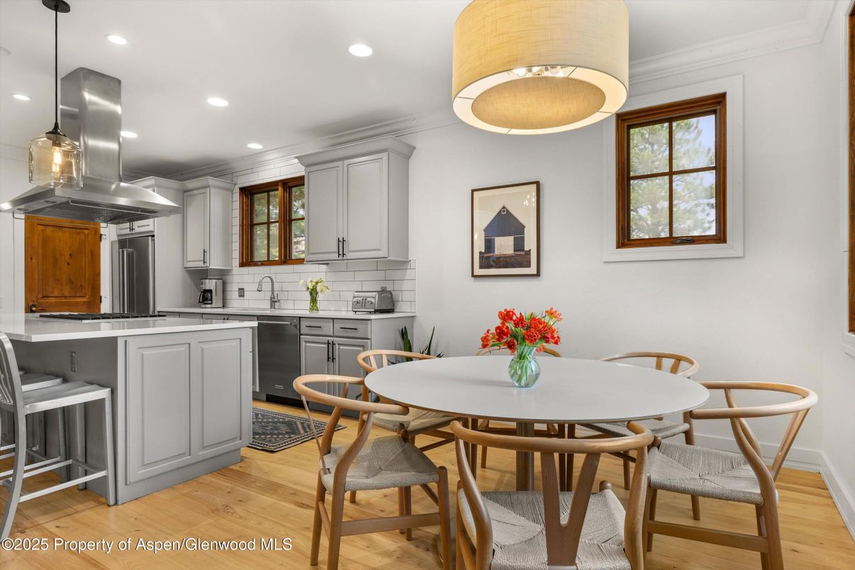 Dining room, Interior, Kitchen, Pendant Lights, Recessed Lighting, Stainless Steel Appliances, Wood Texture Flooring