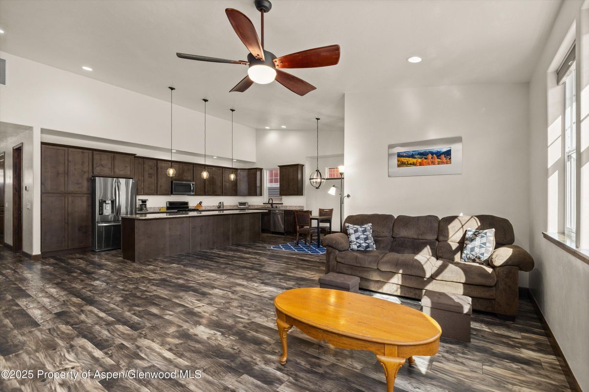 Chandelier, Dining room, Interior, Kitchen, Living room, Pendant Lights, Recessed Lighting, Stainless Steel Appliances, Wood Texture Flooring