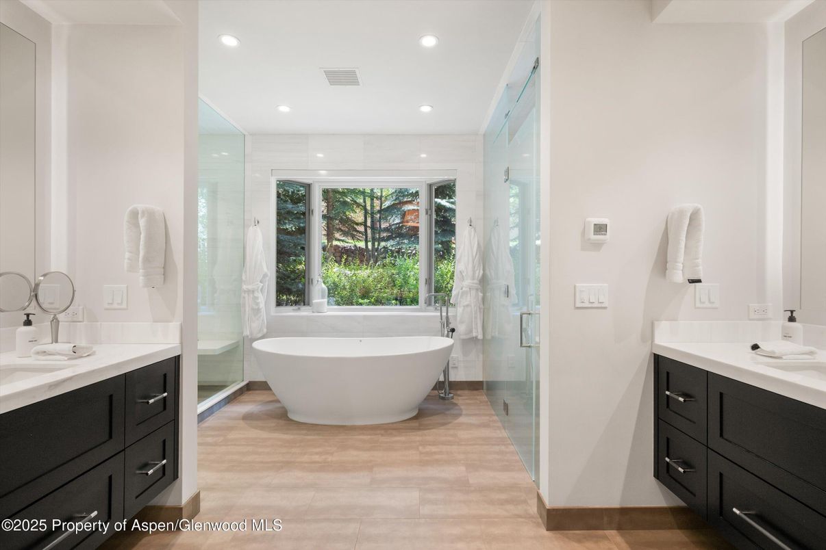 Bathroom, Dual Sink Vanities, Free Standing Baths, Glass Shower, Interior, Recessed Lighting, Wood Texture Flooring
