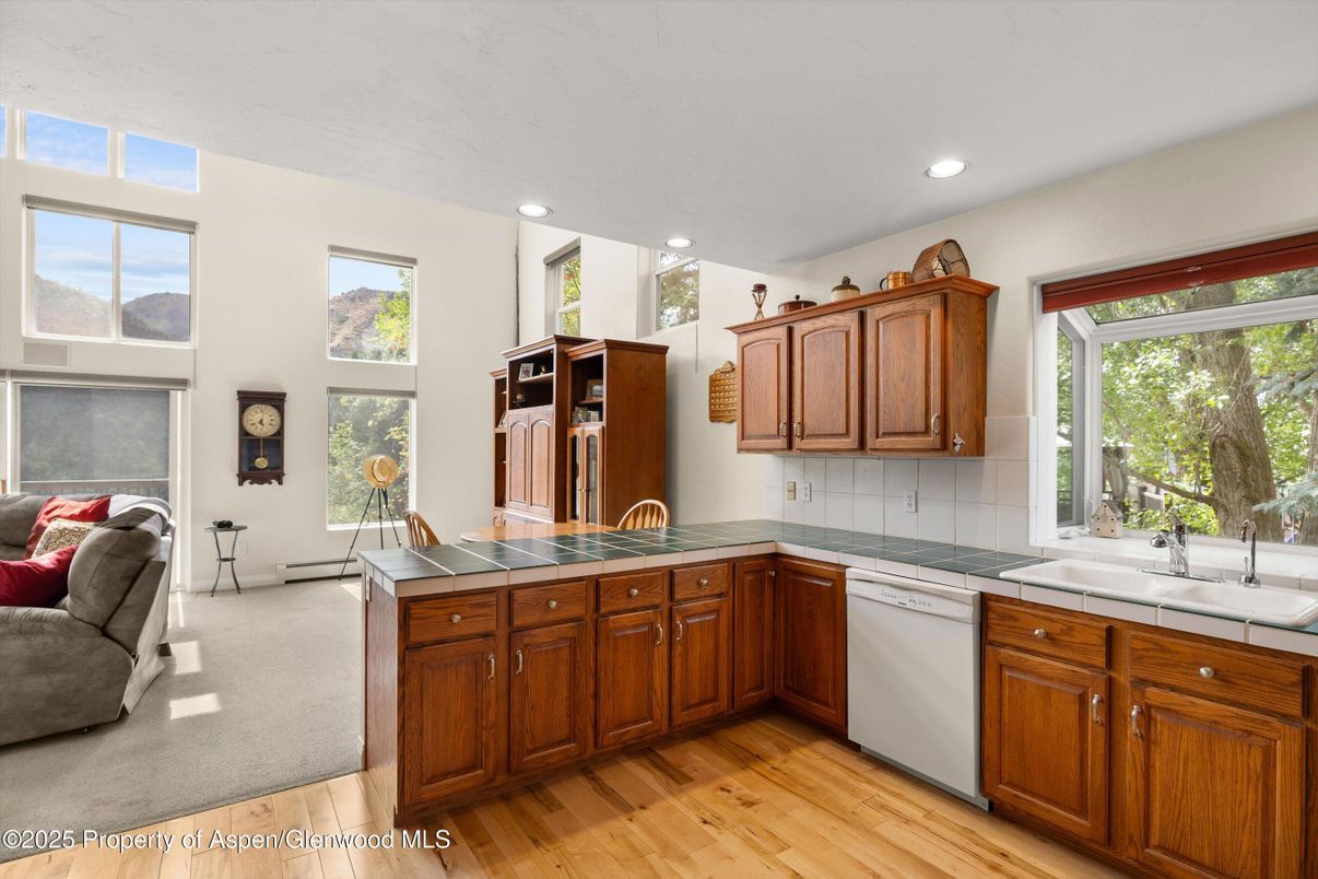 Interior, Kitchen, Recessed Lighting, Tile Countertops, Wood Texture Flooring