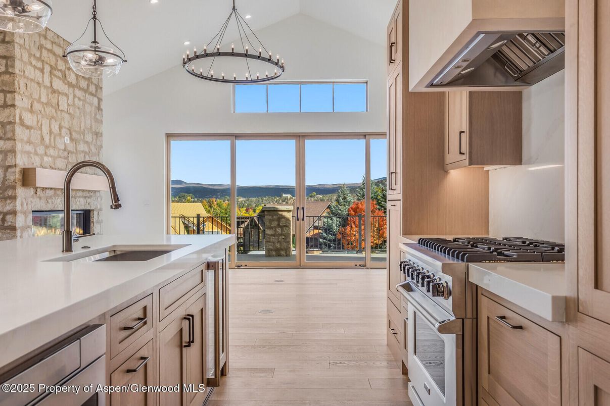 Fireplace, Interior, Kitchen, Pendant Lights, Recessed Lighting, Stainless Steel Appliances, Water, Wood Texture Flooring