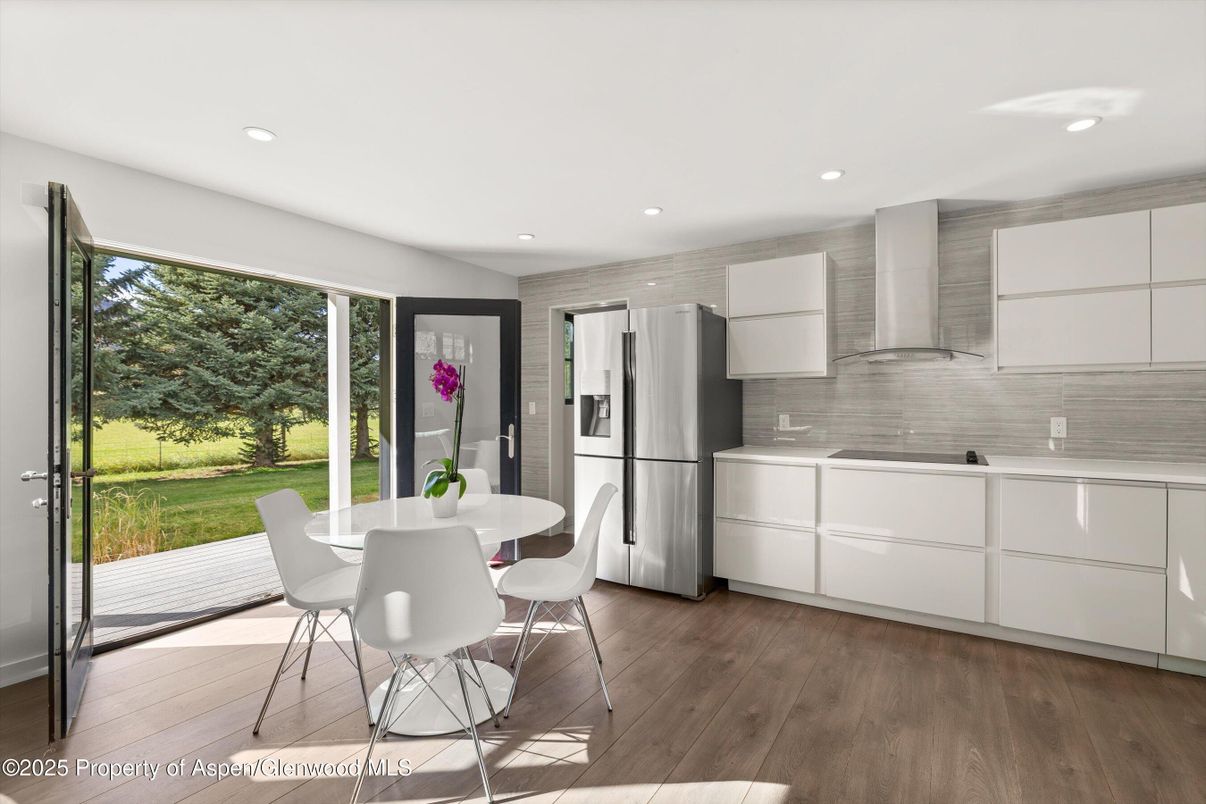 Dining room, Interior, Kitchen, Recessed Lighting, Stainless Steel Appliances, Wood Texture Flooring