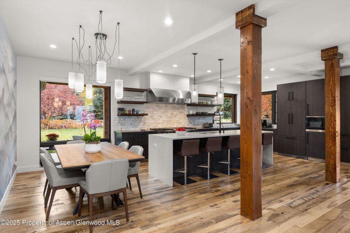 Dining room, Interior, Kitchen, Pendant Lights, Recessed Lighting, Stainless Steel Appliances, Wood Texture Flooring