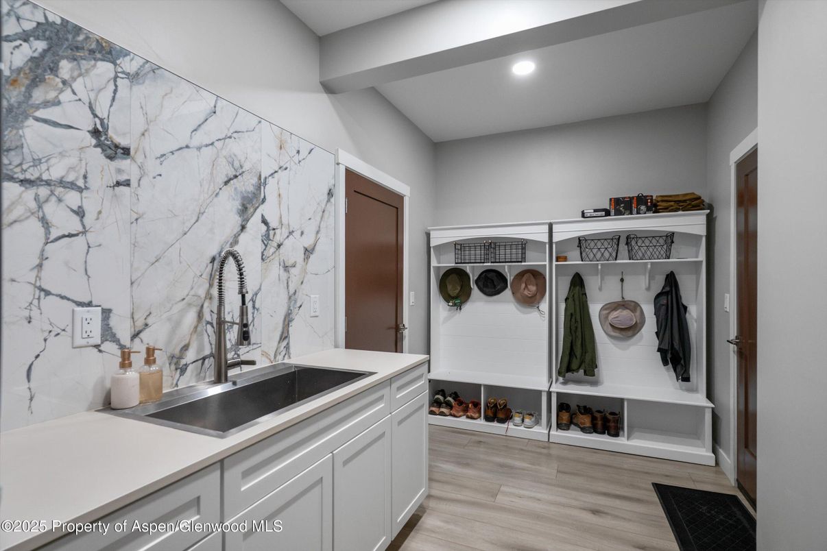 Interior, Marble Walls, Recessed Lighting, Washer, Wood Texture Flooring
