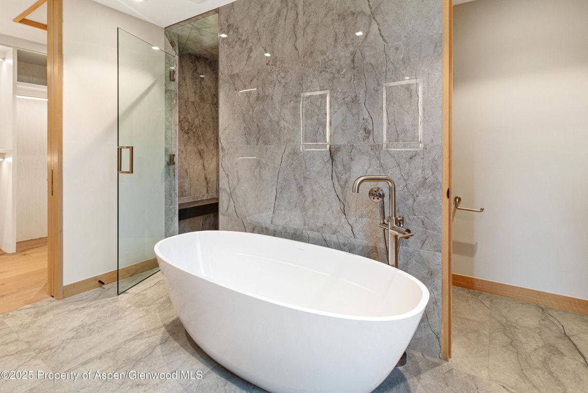 Bathroom, Free Standing Baths, Glass Shower, Interior, Marble, Marble Walls, Recessed Lighting
