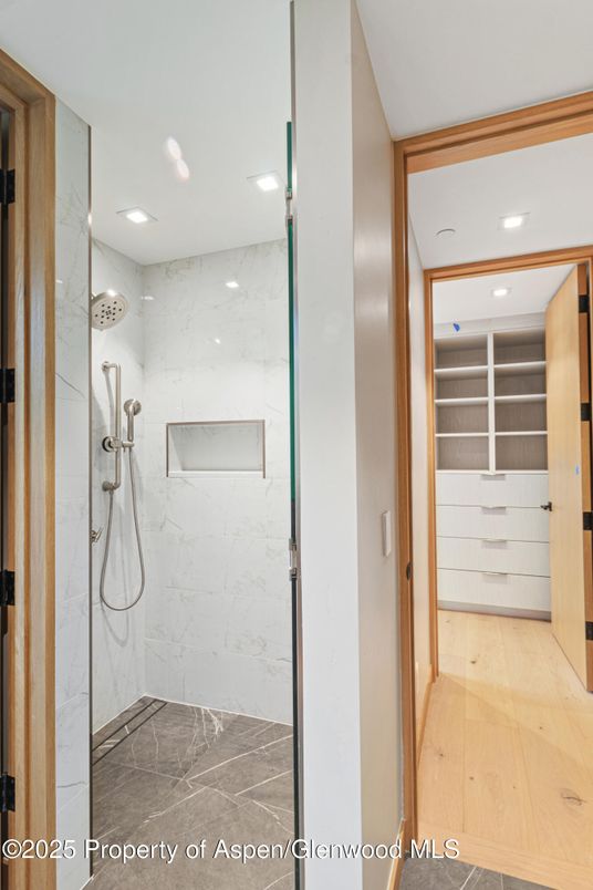 Bathroom, Glass Shower, Interior, Marble Walls, Recessed Lighting, Wood Texture Flooring