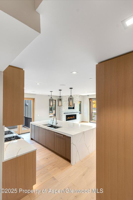 Fireplace, Interior, Kitchen, Pendant Lights, Recessed Lighting, Wood Texture Flooring
