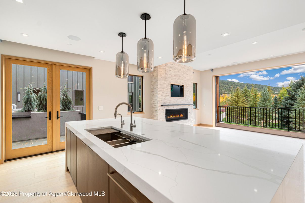 Fireplace, Interior, Kitchen, Pendant Lights, Recessed Lighting, Stone Walls, Wood Texture Flooring