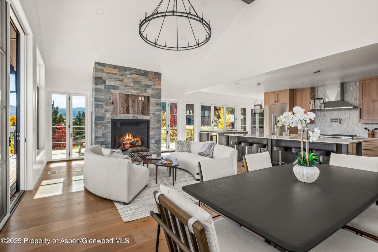 Dining room, Fireplace, Interior, Kitchen, Living room, Pendant Lights, Stone Walls, Wood Texture Flooring