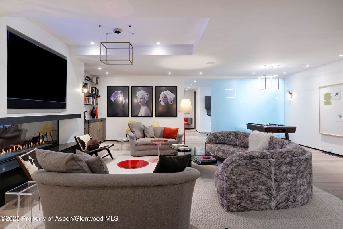 Billiard Table, Fireplace, Game Room, Interior, Living room, Pendant Lights, Recessed Lighting, Wood Texture Flooring