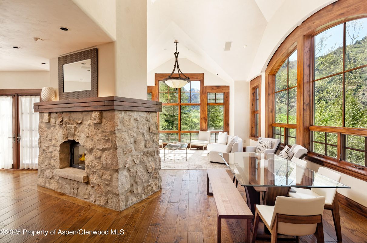 Dining room, Fireplace, Interior, Living room, Pendant Lights, Recessed Lighting, Wood Texture Flooring