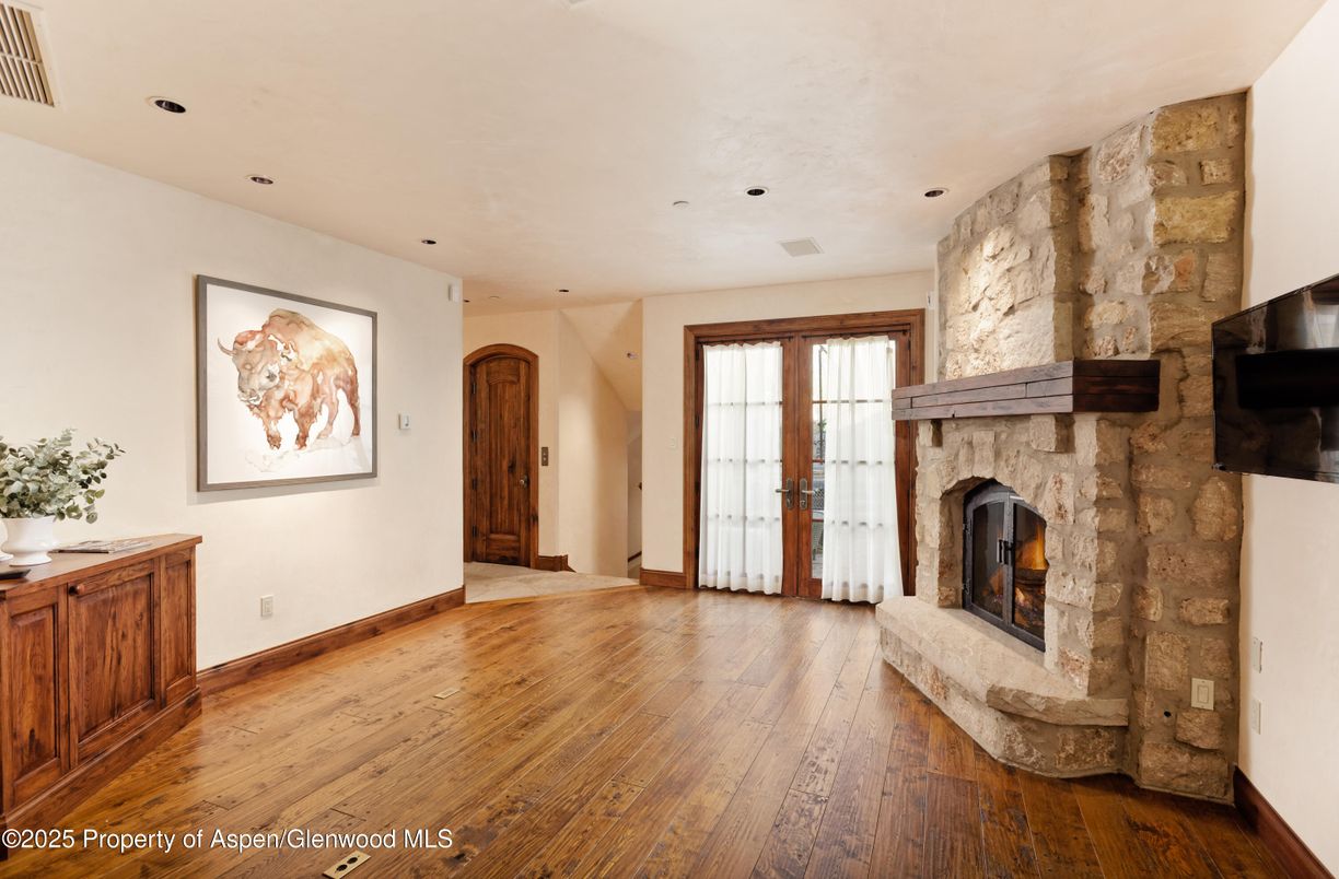 Fireplace, Interior, Recessed Lighting, Stone Walls, Wood Texture Flooring