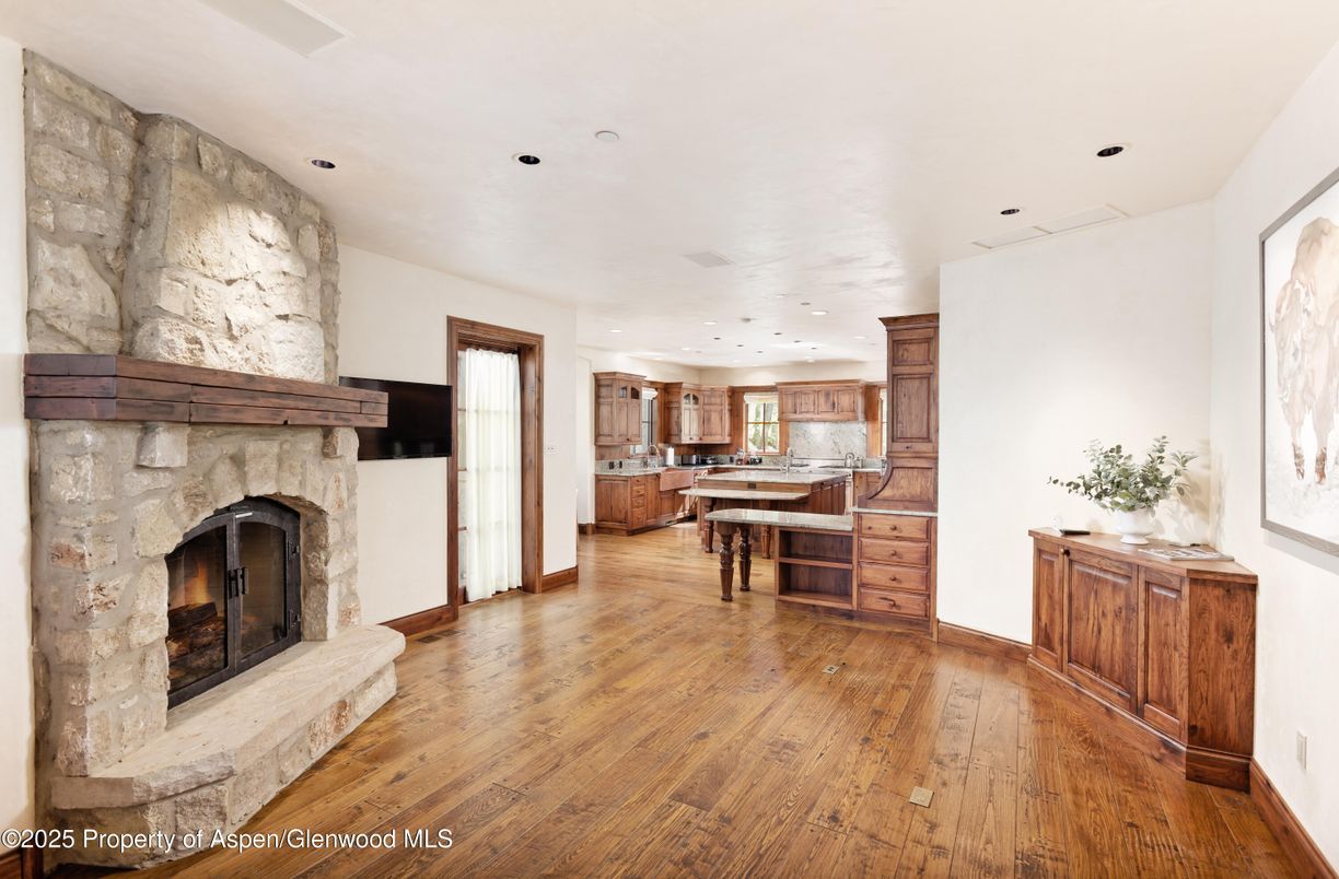 Fireplace, Interior, Kitchen, Recessed Lighting, Stone Walls, Wood Texture Flooring