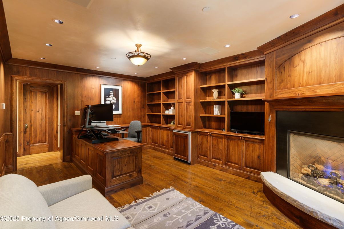 Fireplace, Home Office, Interior, Recessed Lighting, Wood Texture Flooring, Wooden Walls