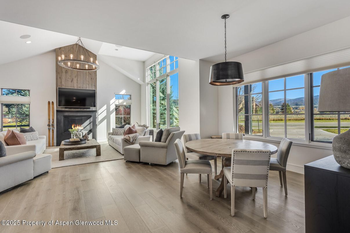 Dining room, Fireplace, Interior, Living room, Pendant Lights, Recessed Lighting, Wood Texture Flooring