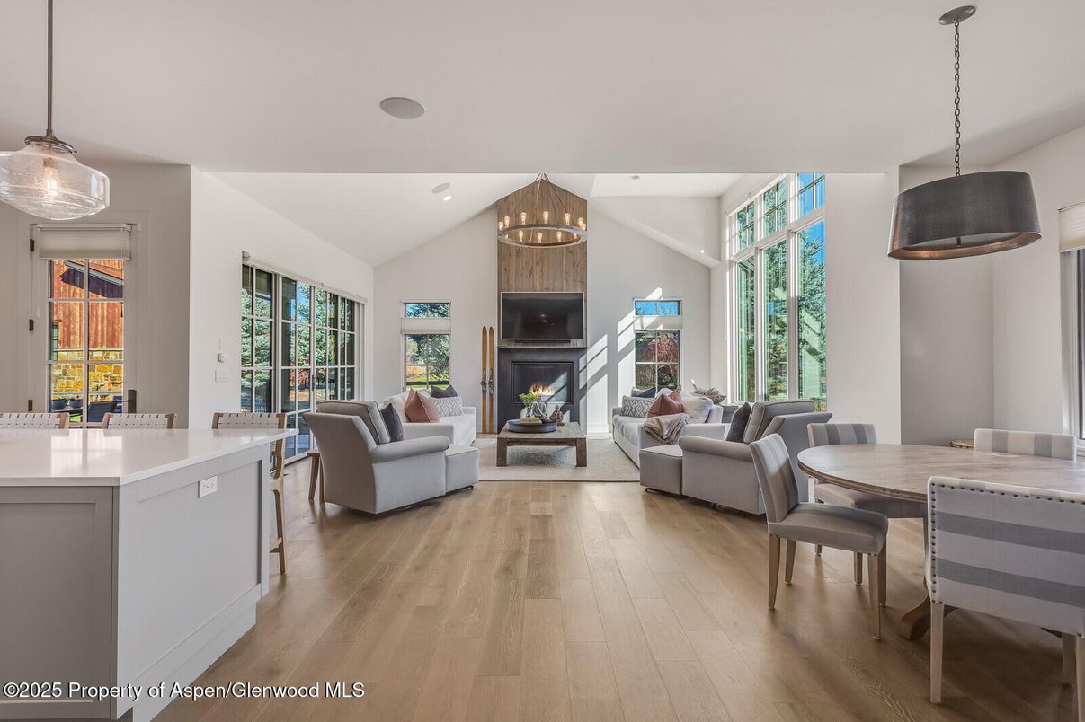 Dining room, Fireplace, Interior, Living room, Pendant Lights, Recessed Lighting, Wood Texture Flooring