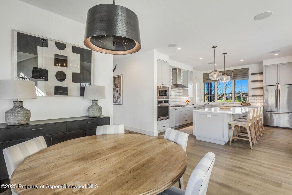 Dining room, Interior, Kitchen, Pendant Lights, Recessed Lighting, Stainless Steel Appliances, Wood Texture Flooring