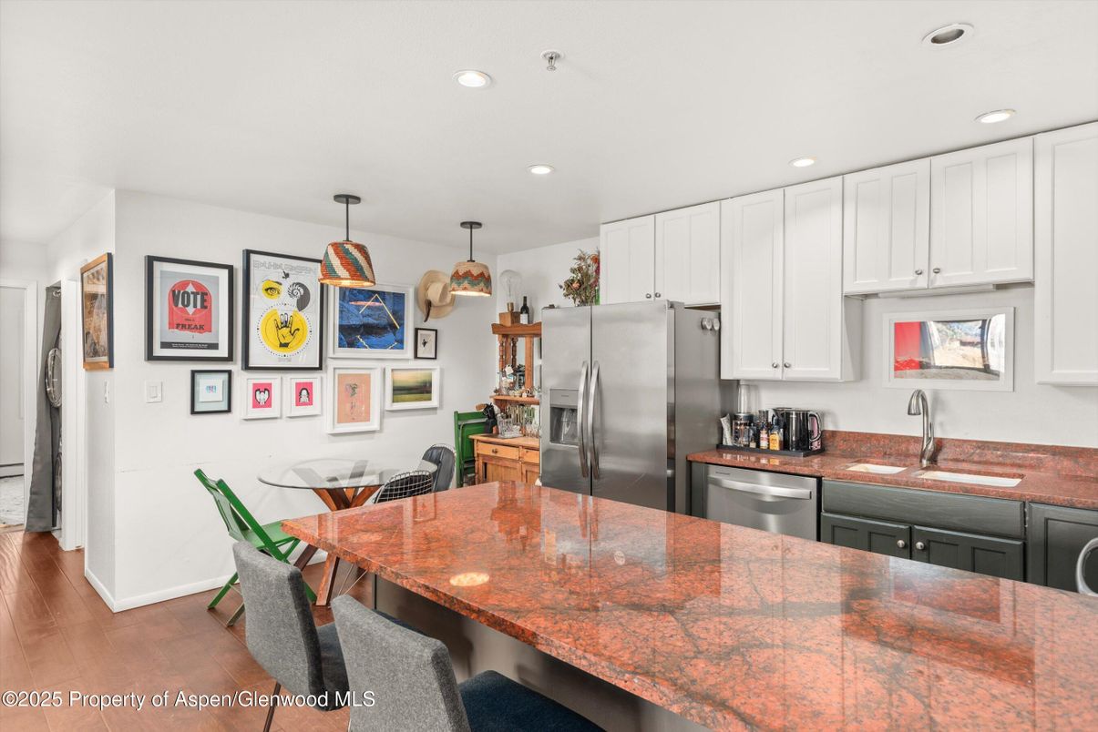 Dining room, Interior, Kitchen, Pendant Lights, Recessed Lighting, Stainless Steel Appliances, Wood Texture Flooring
